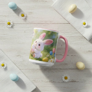 Easter mug with cute bunny and pastel eggs on white wood table with daisies and candy eggs