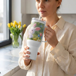Woman drinking from large white tumbler with cute bunny and spring flowers design