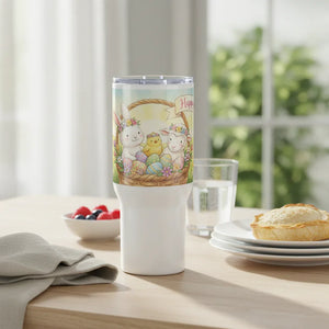 Easter-themed tumbler with bunny, chick, lamb, eggs and flowers on breakfast table