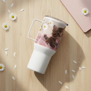 White travel mug with kitten and daisy print on wooden table with scattered daisies