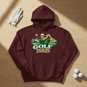 Maroon hoodie with Golf Dad graphic, golf glove and golf balls on wooden surface