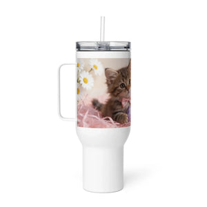 White travel mug with handle featuring a cute kitten, daisies, and pink straw accents.