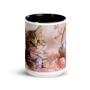 White ceramic mug with black interior featuring a kitten with pink bow and Easter eggs