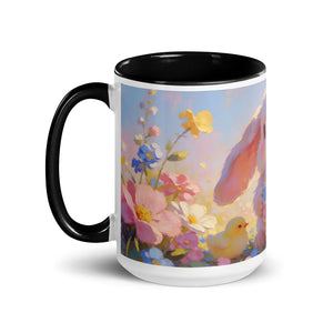 White ceramic mug with black handle and interior, featuring a colorful spring floral design with a bunny and chick illustration.