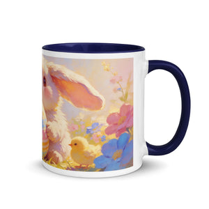 White ceramic mug with dark blue interior, featuring a cute bunny and chick among colorful spring flowers
