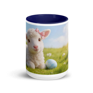 White ceramic mug with dark blue interior featuring a cute lamb and blue Easter egg design