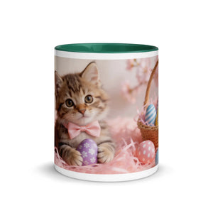White ceramic mug with dark green interior, featuring a kitten with a pink bow and Easter eggs
