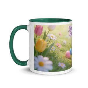 White ceramic mug with dark green handle and interior, featuring spring flowers and Easter eggs.