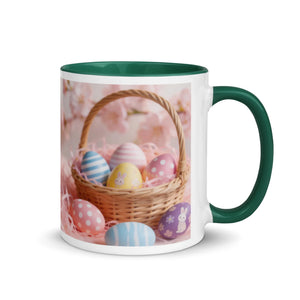 White ceramic mug with dark green handle and interior, decorated with an Easter egg basket design.