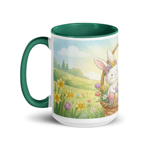 White ceramic mug with green handle, featuring a cute bunny, flowers, and Easter eggs design.