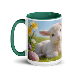 White ceramic mug with dark green handle and interior, featuring a cute lamb, Easter eggs, and spring flowers design.