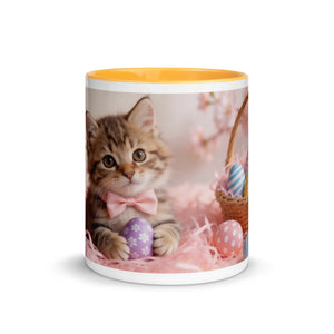 White ceramic mug with golden yellow interior featuring a cute kitten, pastel Easter eggs, and a basket.