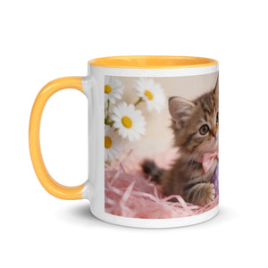 White ceramic mug with golden yellow handle and interior, featuring a kitten and daisies design
