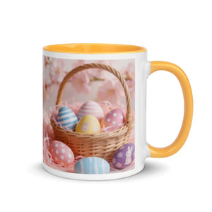 White ceramic mug with yellow handle and interior, featuring a basket of colorful Easter eggs.