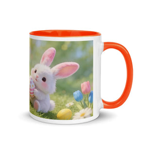 White ceramic mug with orange handle and interior, featuring a cute bunny and spring flowers design