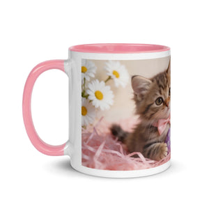 White ceramic mug with pink handle and rim, featuring a kitten, daisies, and pink decor