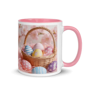White ceramic mug with pink interior and handle, featuring a basket of colorful Easter eggs