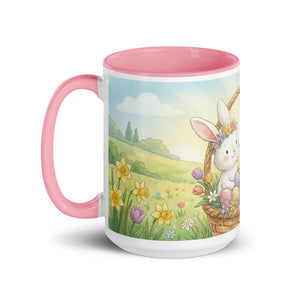 White ceramic mug with pink handle and interior, featuring a cute bunny and spring flowers design.