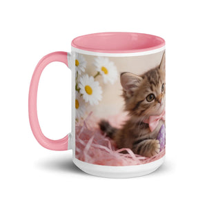 White ceramic mug with pink interior and handle, featuring a cute kitten and daisies design