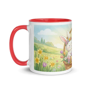 White ceramic mug with red handle and interior, featuring a cute bunny in a spring flower field illustration.