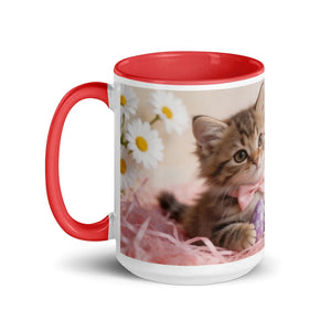 White ceramic mug with red handle, featuring a kitten with pink bow and daisies design