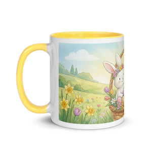White ceramic mug with yellow interior, featuring a cute bunny in a flower basket, spring meadow scene.