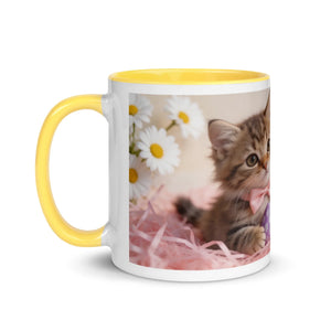 White ceramic mug with yellow handle, cute kitten, daisies, and pink decorative paper