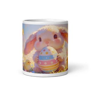 White glossy mug featuring a cute bunny holding a colorful Easter egg, spring design