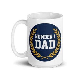 White ceramic mug with 'Number 1 Dad' design and gold laurel on navy background