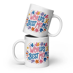 Two white ceramic mugs with colorful 'World's Best Mom' floral design, front view.