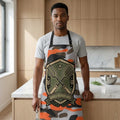 Man in kitchen wearing camo apron with 'Grill Sergeant' badge, holding barbecue spatula