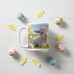 Easter mug with lamb and flowers, surrounded by pastel eggs and yellow petals on white table