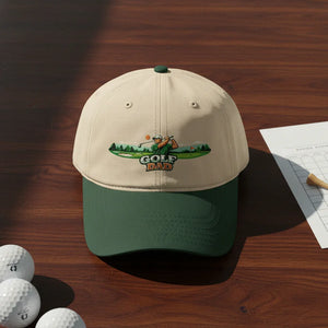 Golf Dad beige and green baseball cap with golfer graphic on wooden table, golf balls nearby