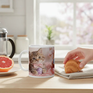 Ceramic mug with cute kitten and pastel Easter egg design on breakfast table with croissant