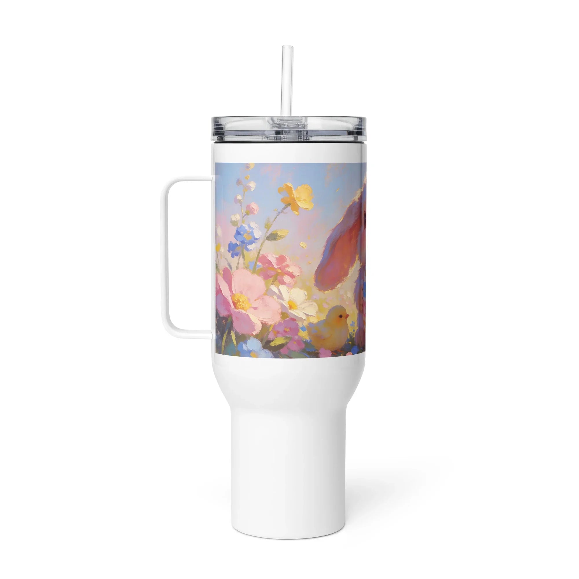 White travel mug with handle, featuring a bunny, chick, and spring flowers illustration.
