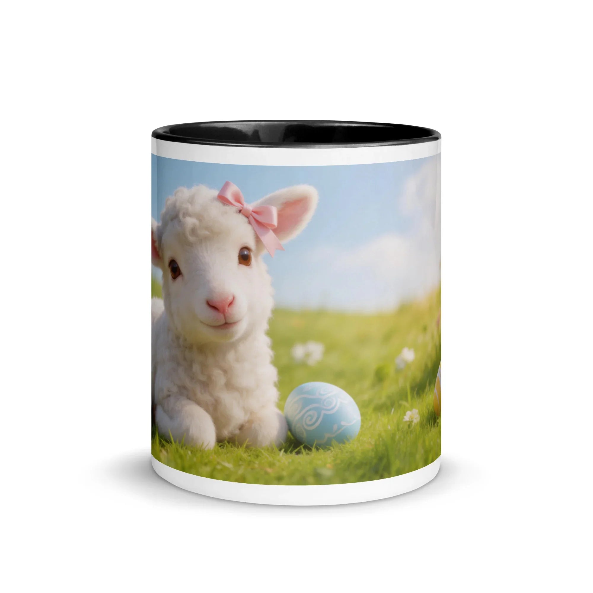 White ceramic mug with black interior featuring a cute lamb with pink bow and Easter egg design