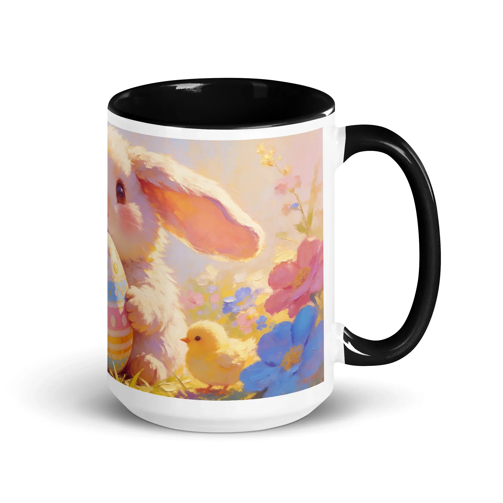 White ceramic mug with black handle and rim, featuring a cute bunny, chick, and colorful flowers.