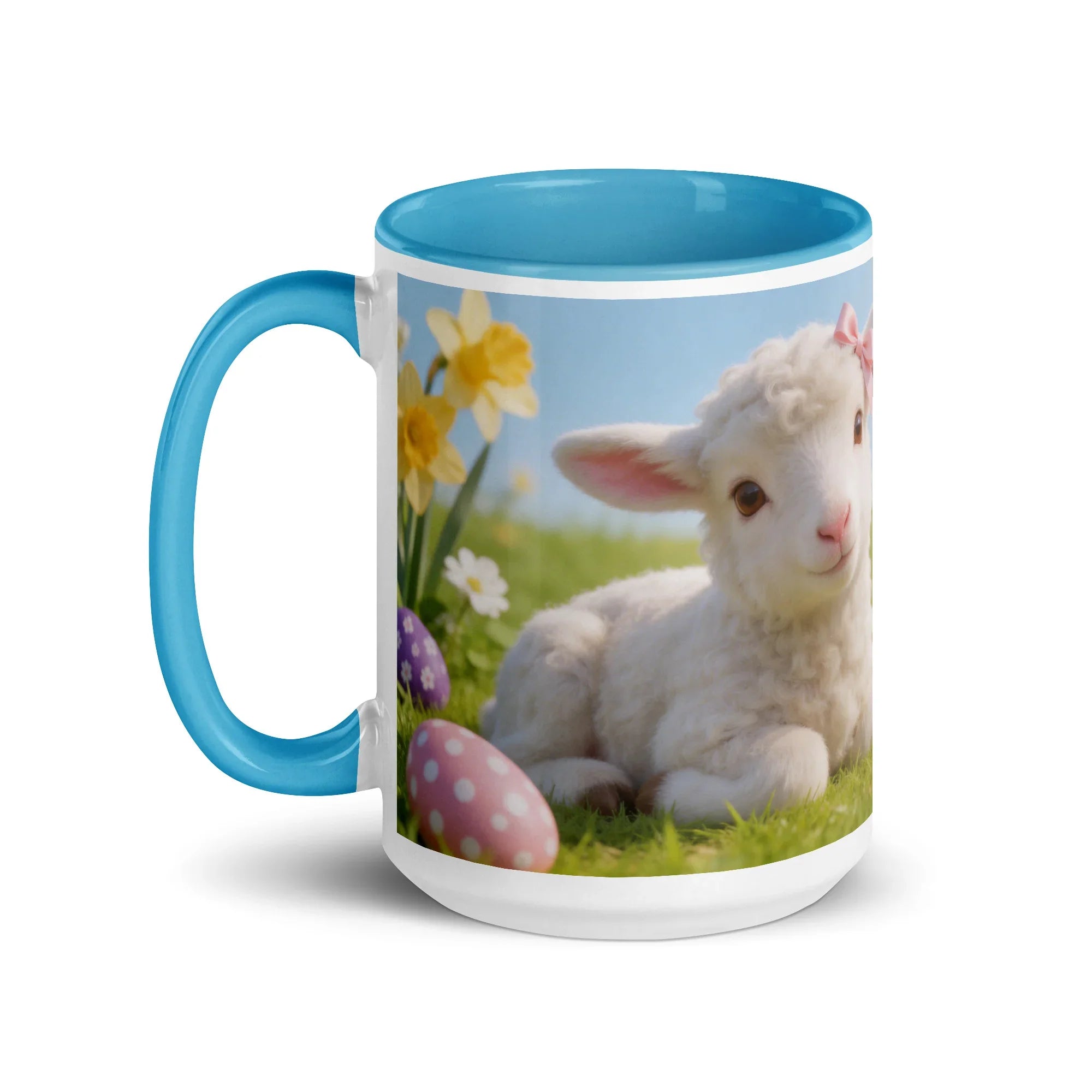 White ceramic mug with blue handle and interior, featuring a spring lamb, daffodils, and Easter eggs.
