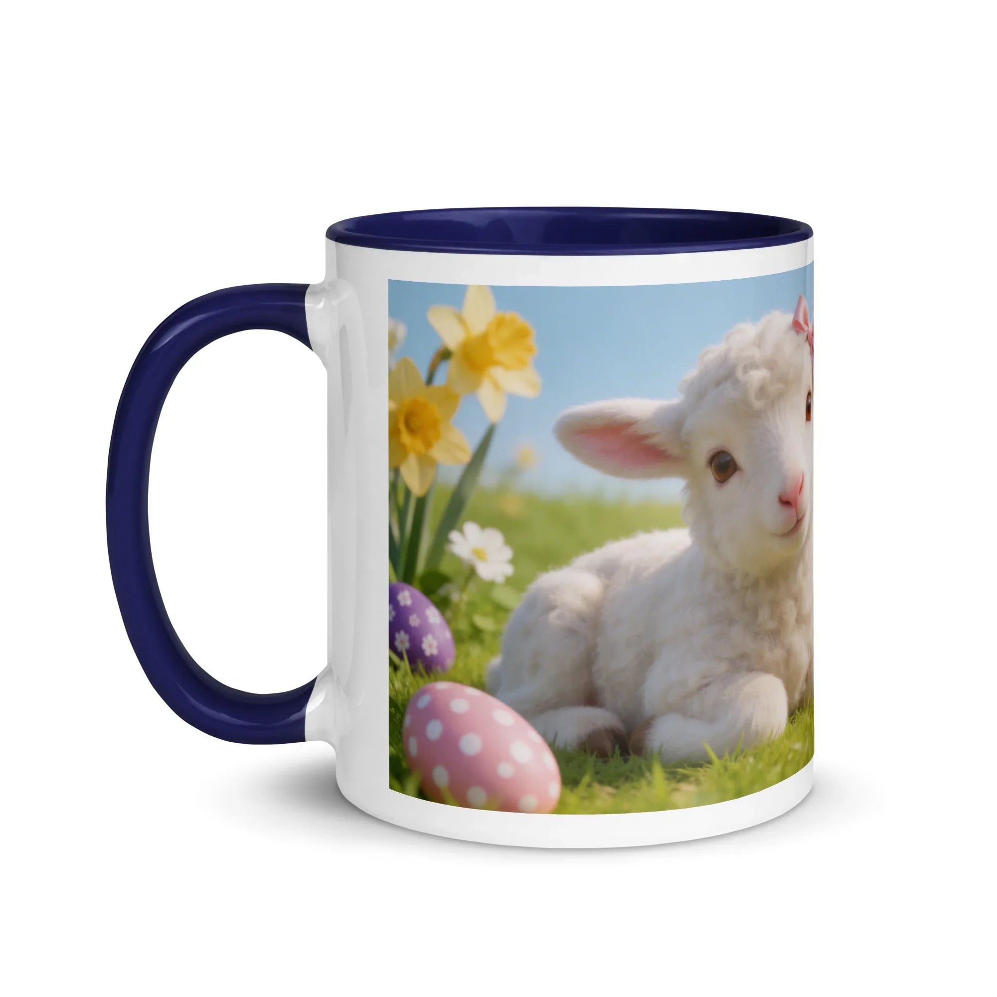 White ceramic mug with dark blue handle and rim, featuring a lamb, flowers, and Easter eggs design.