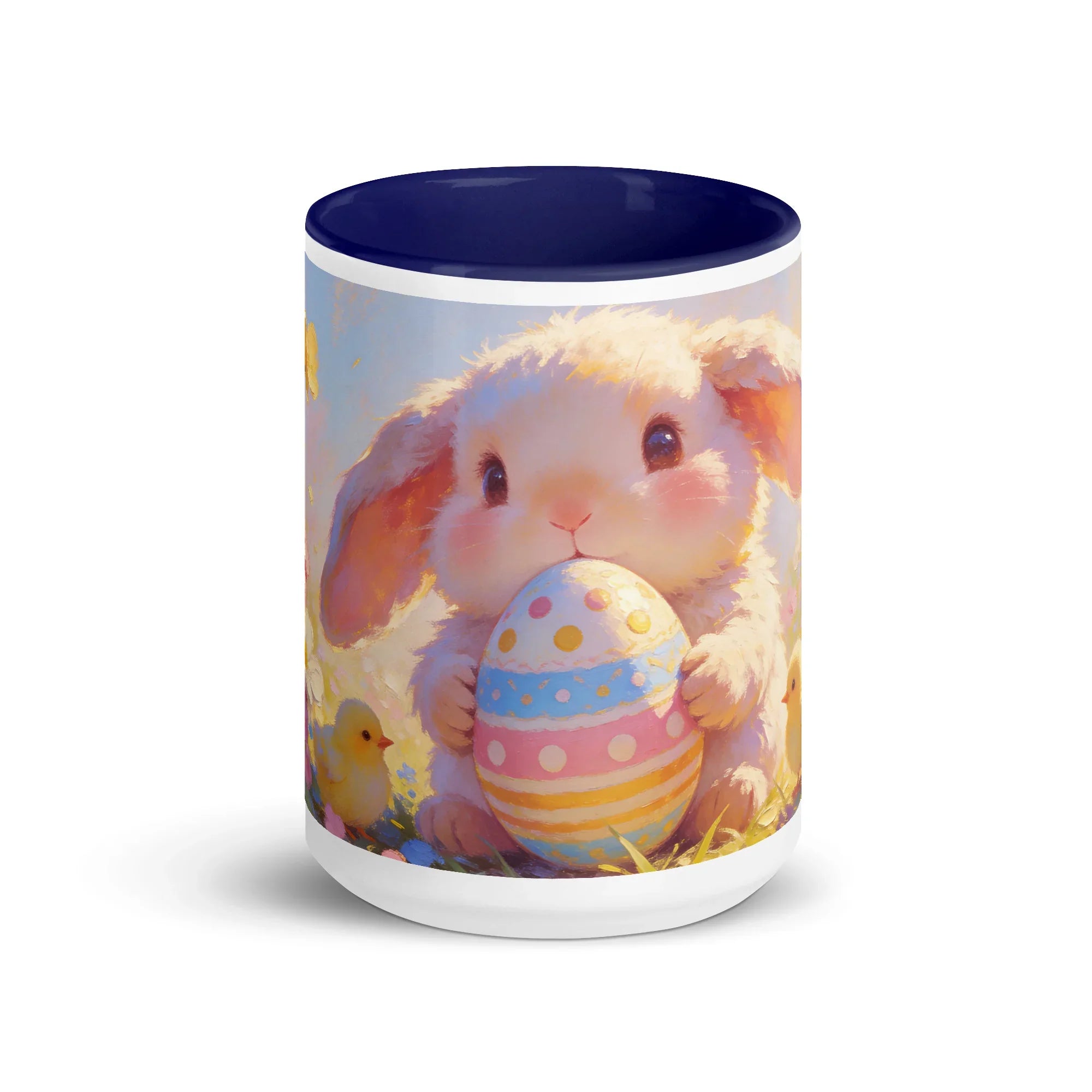 White ceramic mug with dark blue interior featuring a cute bunny holding a decorated Easter egg