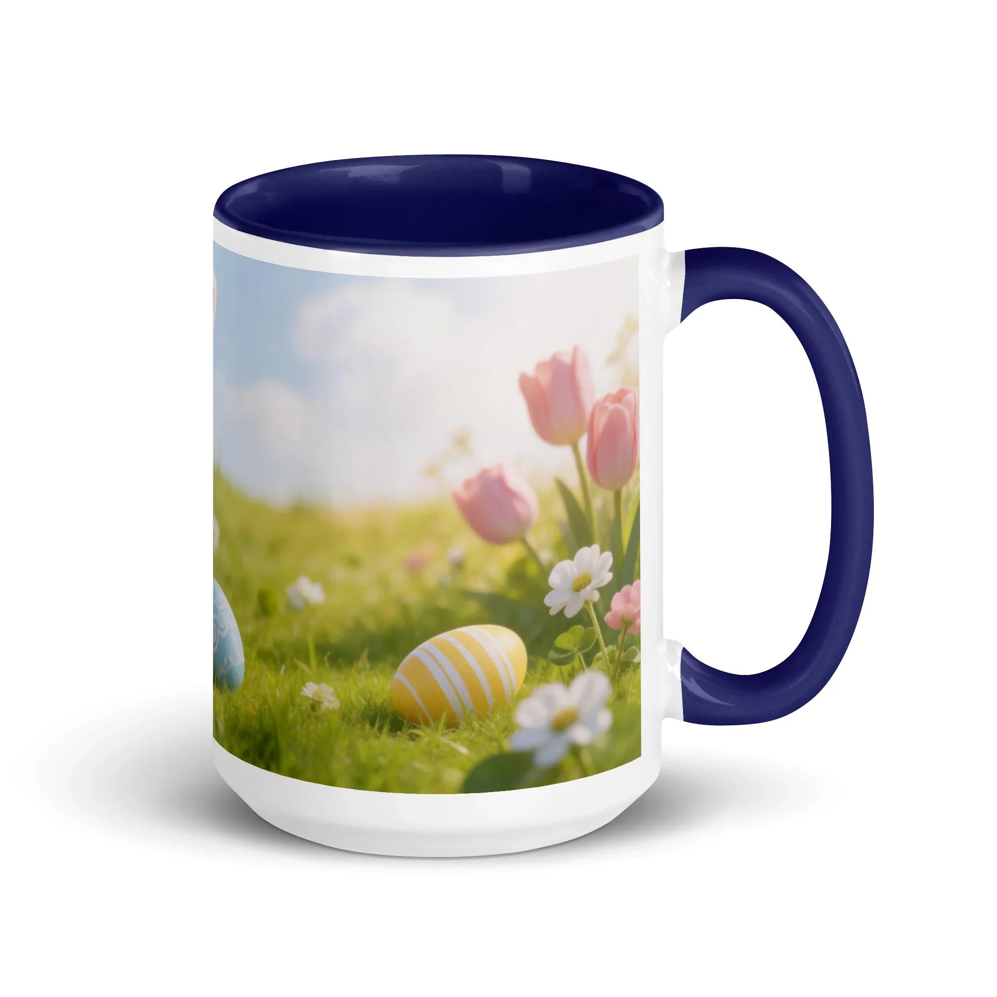 White ceramic mug with dark blue handle and interior, floral and Easter egg design