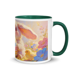 White ceramic mug with dark green handle, featuring a cute bunny, chick, and colorful flowers.