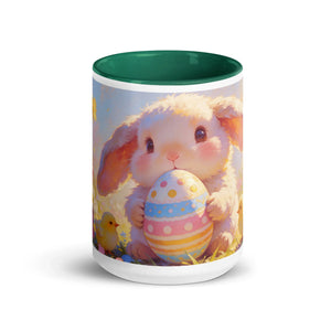 White ceramic mug with green interior, featuring a cute bunny holding a colorful Easter egg.
