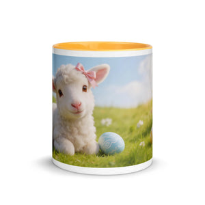 White ceramic mug with golden yellow interior, decorated with a cute lamb and Easter egg design.