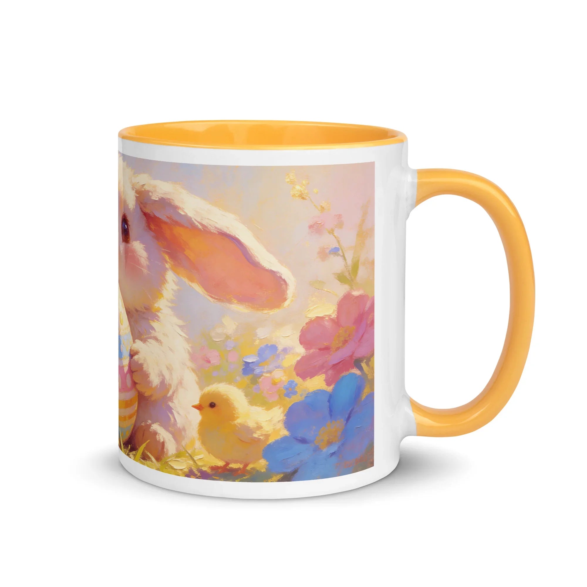White ceramic mug with yellow handle and interior, featuring a cute bunny, chick, and colorful spring flowers printed on the side.