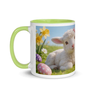 White ceramic mug with green handle, featuring a cute lamb, daffodils, and Easter eggs design