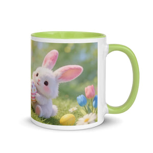 White ceramic mug with green handle featuring a cute bunny, Easter eggs, and spring flowers.
