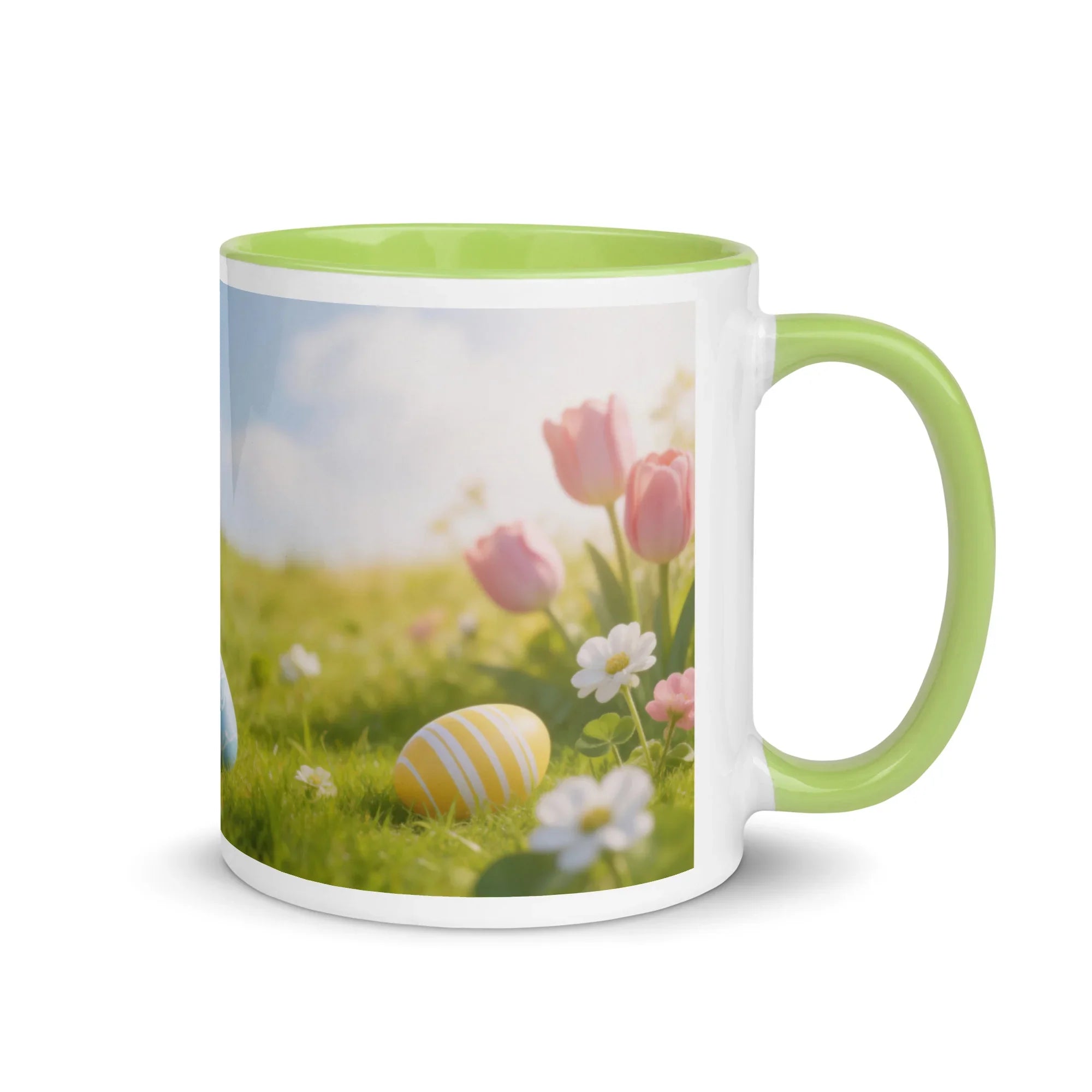 White ceramic mug with green handle and interior, featuring spring flowers and Easter eggs design