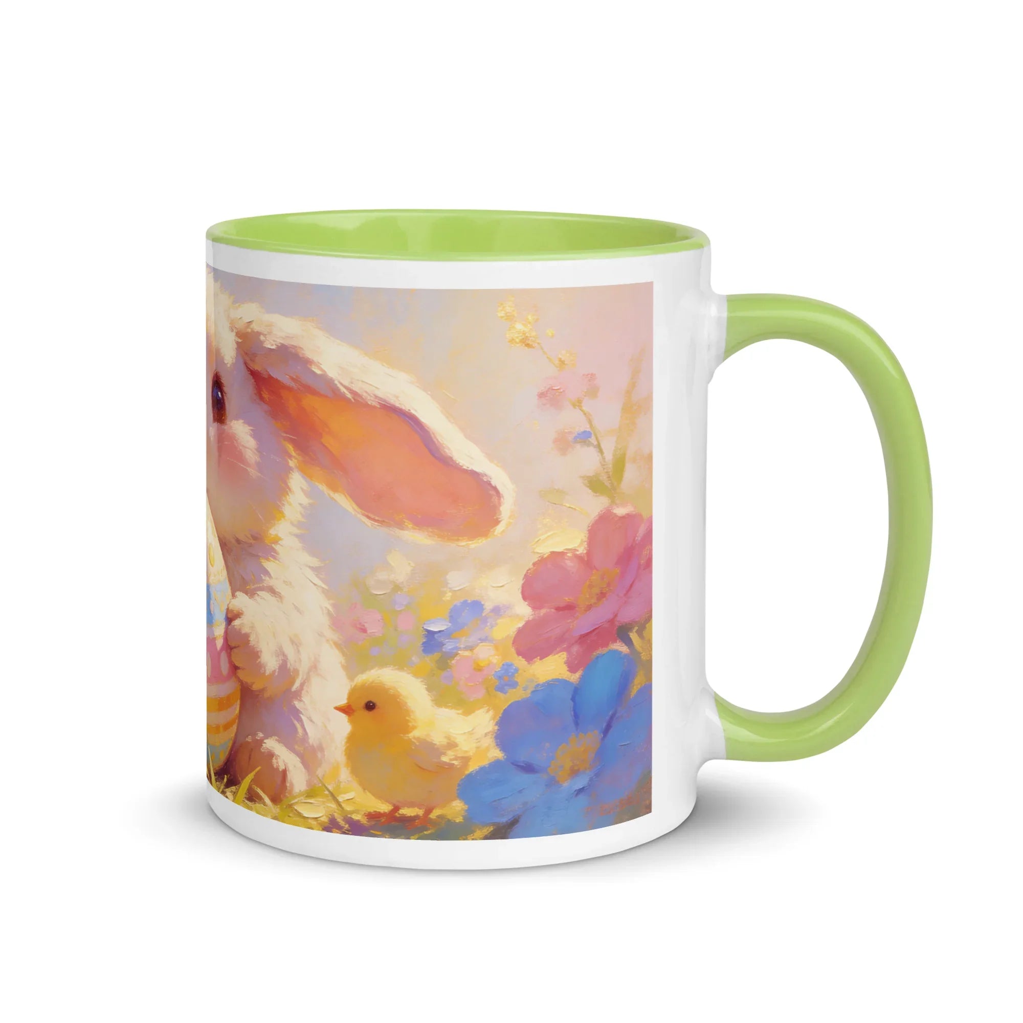 White ceramic mug with green handle and interior, featuring a pastel bunny, chick, and flowers illustration