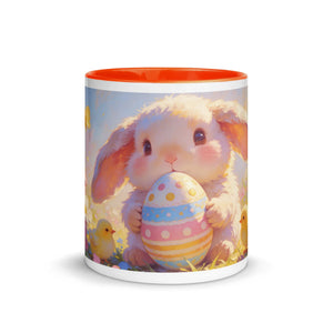 White ceramic mug with orange interior featuring a cute bunny holding an Easter egg